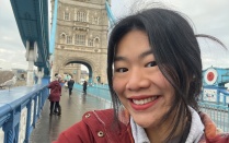 young woman with bridge in background. 