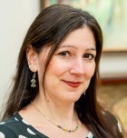 woman wearing black and white polkadot top. 