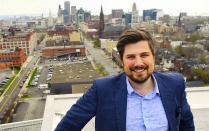 Matthew Pelkey in front of Buffalo's city-scape. 