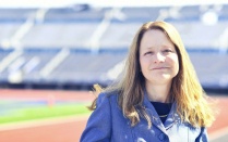 Nellie Drew standing outside in a football stadium. 