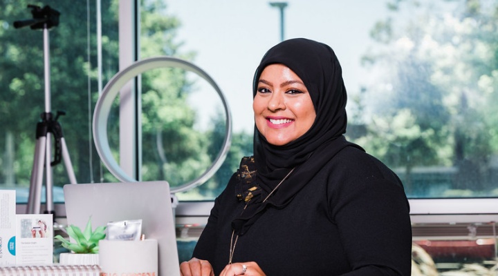 El-Rahman sitting at a table. 