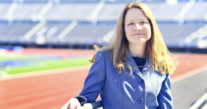 Nellie Drew standing outside in a stadium. 