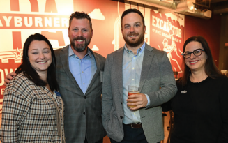 Zoom image: Emilie Rosenbluth, director of advancement, Jeffrey P. Gleason &rsquo;08, Bryan Carlo &rsquo;25 and Stephanie A. Mack &rsquo;08, executive director of the UB Law Alumni Association. 