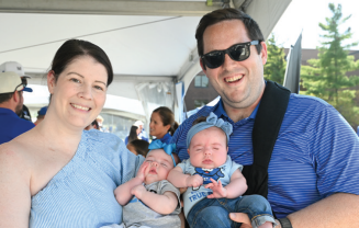 Zoom image: Ann C. Dillon Flynn &rsquo;15 and Conor T. Flynn &rsquo;15 with twins, Fiadhna (left) and Clodagh (right). 