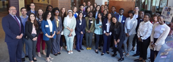 group of diverse students posting for a photo. 