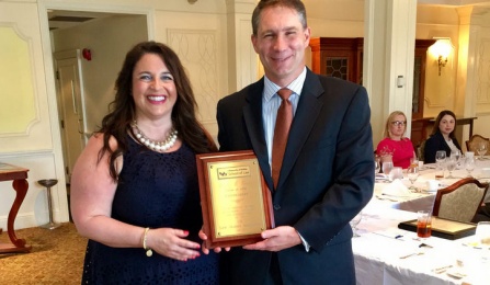 Pietra Zaffram '01 presenting the Outgoing Presidents Award to Brian Gwitt '98.