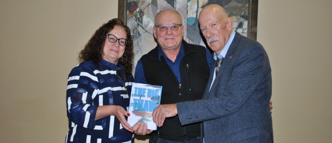 Book editors posing with the book. 