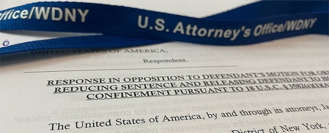 photo of a document and lanyard for the US Attorney's Office. 