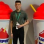 Williams standing between two Slurpie displays. 
