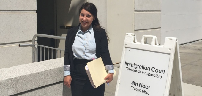 Shelby Scibetta standing outside a government building. 