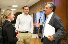 Zoom image: U.S. Solicitor General Noel Francisco speaks with law students following his presentation. 