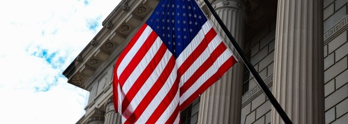Flag in front of a federal building. 