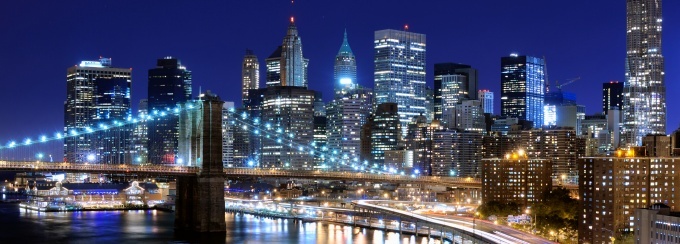 photo of new york city skyline at night. 