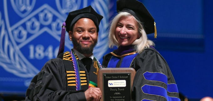 Kevin L. Southern '19 presents Prof. Christine P. Bartholomew with the Faculty Award. 