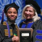Kevin L. Southern '19 presents Prof. Christine P. Bartholomew with the Faculty Award. 