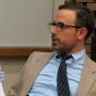 photo of Boucai participating in a faculty discussion panel. 