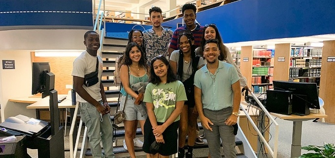 Some of the Discover Law Scholars pose for a photo during a tour of the Charles B. Sears Law Library in O'Brian Hall on the North Campus. 