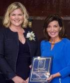 Receiving a Distinguished Alumna Award for contributions by a non-alumna from the UB Law Alumni Association. 