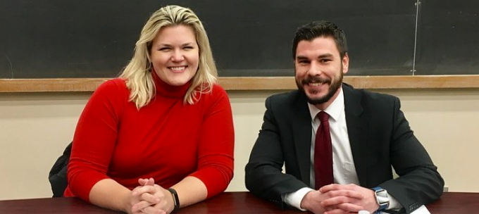 Anne Joynt '05 and Ryan Parisi '10 sitting at a table. 