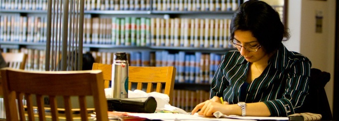 student reading in the library. 