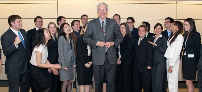 phil halpern standing in the middle of a crowd of students. 