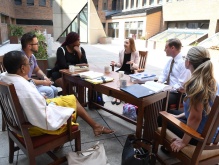 Abraham teaches a class outside. 