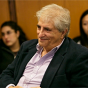 man smiling in a conference room. 