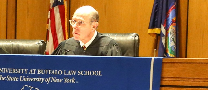 Judge Fahey sitting at a courtroom bench. 