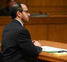 competitor sitting at a table. 