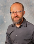 portrait of a man wearing glasses. 