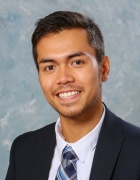 portrait phot of a man smiling. 