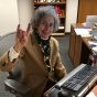 Zubrow sitting at her desk. 