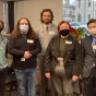 group of people, some wearing masks. 