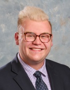 portrait of a young man wearing glasses. 