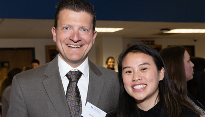 Matthew M. Becker '02 and Theresa Lee '25, smiling. 