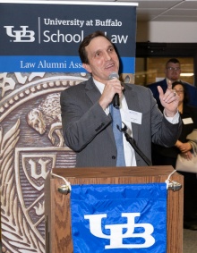 LAA Mentor Chair John C. Godsoe ’00 standing at a podium. 