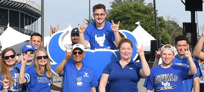 group of people outside, wearing blue UB Bulls tshirts. 