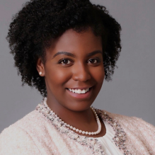 photo of a young woman, smiling. 