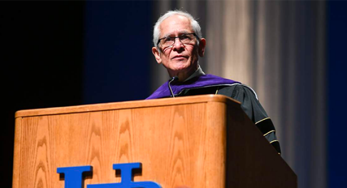 man speaking at a podium. 