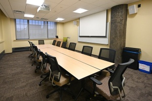 large room with table and chairs. 