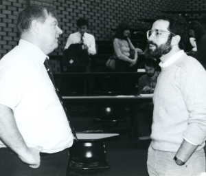 black and white photo of Prof. Joyce speaking with a law student after class. 