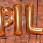 balloon letters that spell out BPILP. 