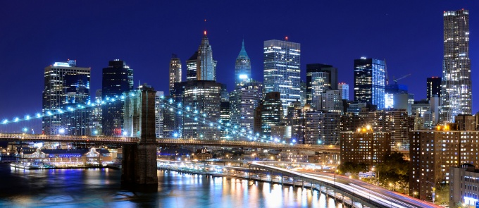 photo of the NYC skyline in the evening. 