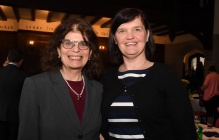 Two women smiling for a photo. 