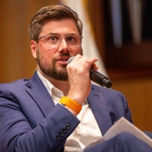 man speaking into a microphone. 