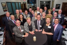 Class of 1975 gathered together, smiling. 