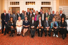 Class of 1980 gathered together, smiling. 