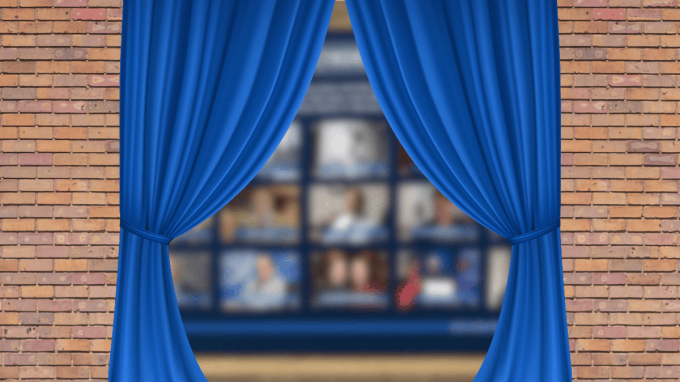 Blue stage curtains part to reveal a blurred grid of video call windows framed by brick walls. 