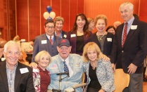 Kenneth Joyce surrounded by family and friends. 