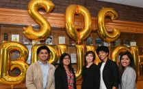 Law students pose with balloons. 